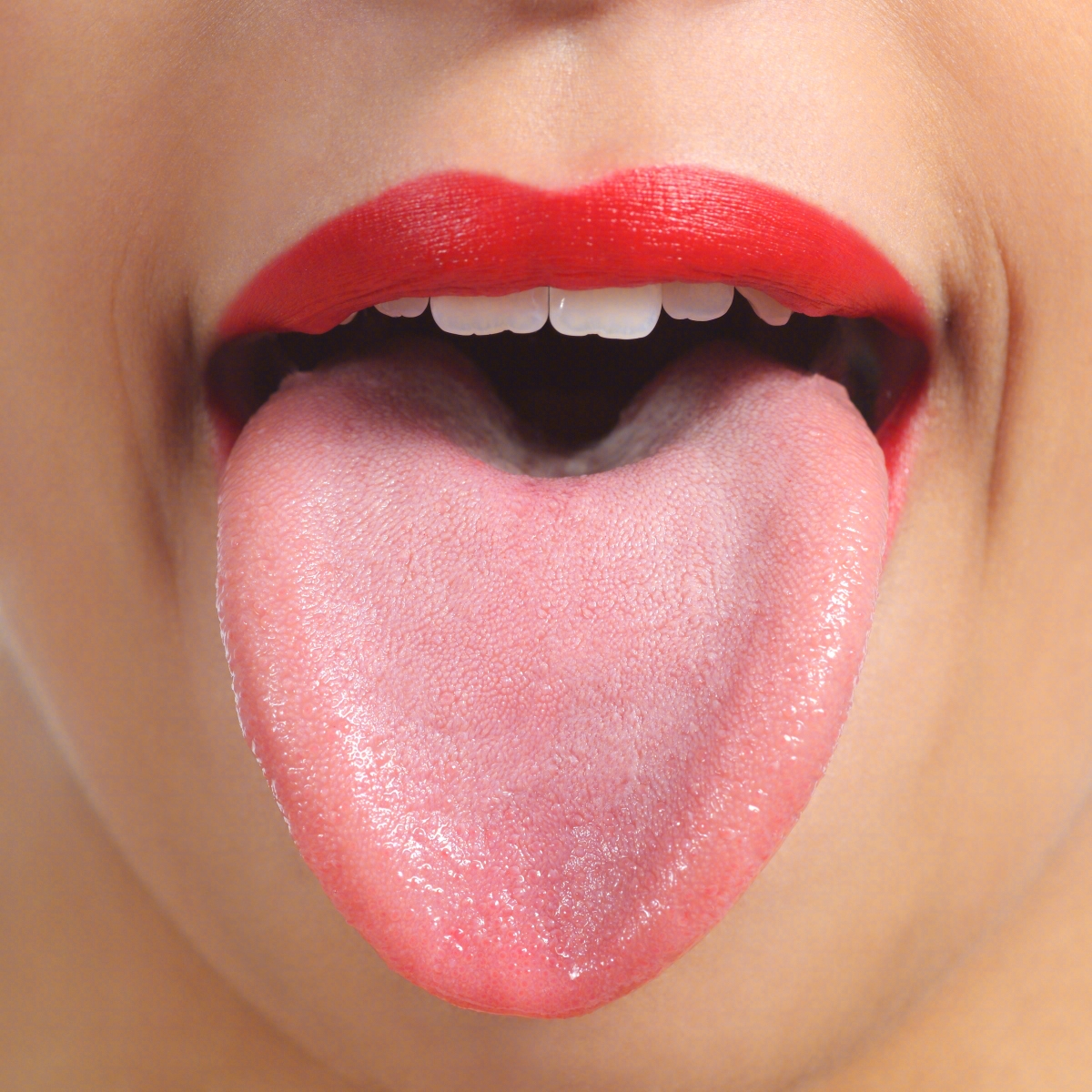 舌头伸着的漂亮年轻女人照片摄影图片_ID:311789442-Veer图库